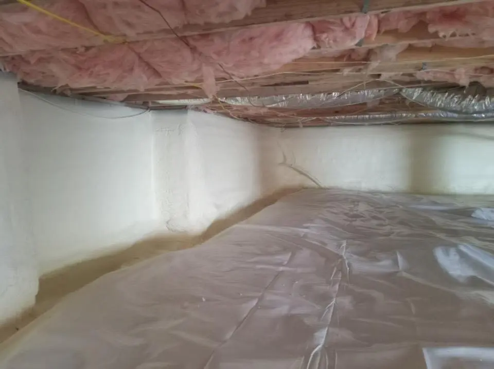 Crawl space encapsulation with closed-cell spray foam for Commercial Roof Restoration in Wahpeton